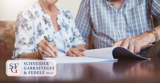 elder people signing a document