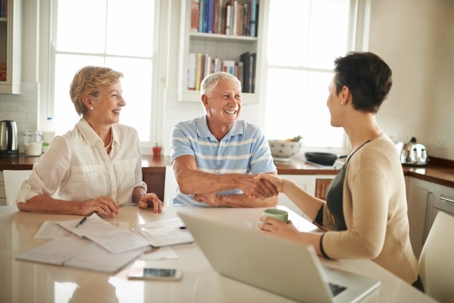 Elderly couple working with a pooled income trust expert.